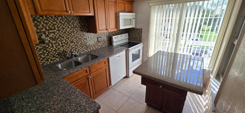 Photo of 4154 Inverrary Drive #302, Lauderhill, FL 33319 (MLS # B26089319)