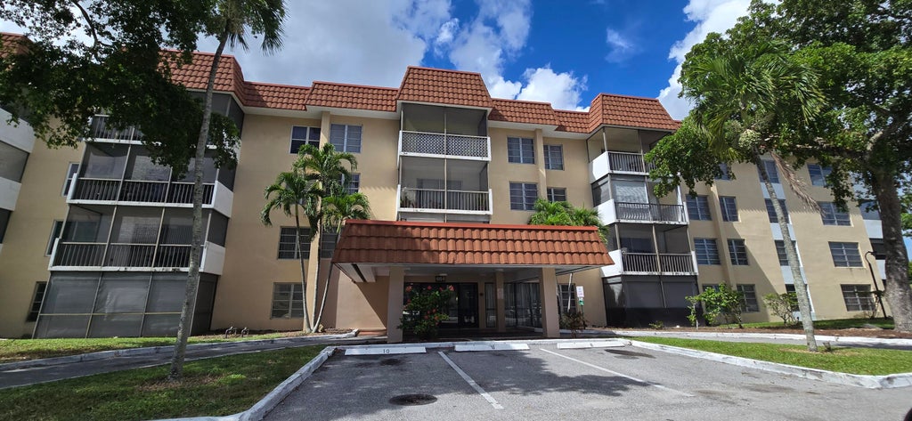 Photo of 4154 Inverrary Drive #302, Lauderhill, FL 33319 (MLS # B26089319)
