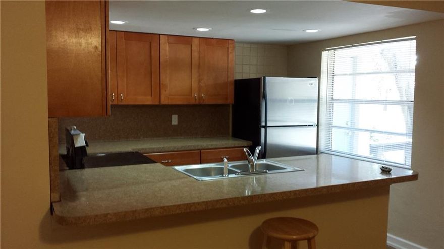 Renovated Huge One Bedroom with wood like flooring, new kitchen with new cabinets, countertops and appliances. Pass through kitchen with bar passthrough. Two full updated bathrooms with new tile and cabinets, Huge Living Room, Huge bedroom, new light package, large private patio, new impact windows and doors, quaint and small 7 unit single story apt building on a very nice street. small pets welcome with $350 pet fee. Professional Management. Don't miss it!