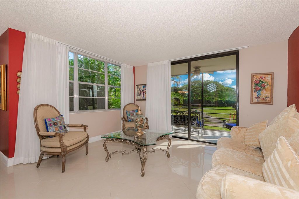Photo of 1200 Saint Charles Pl #L-19, Pembroke Pines, FL 33026 (MLS # F10540353)