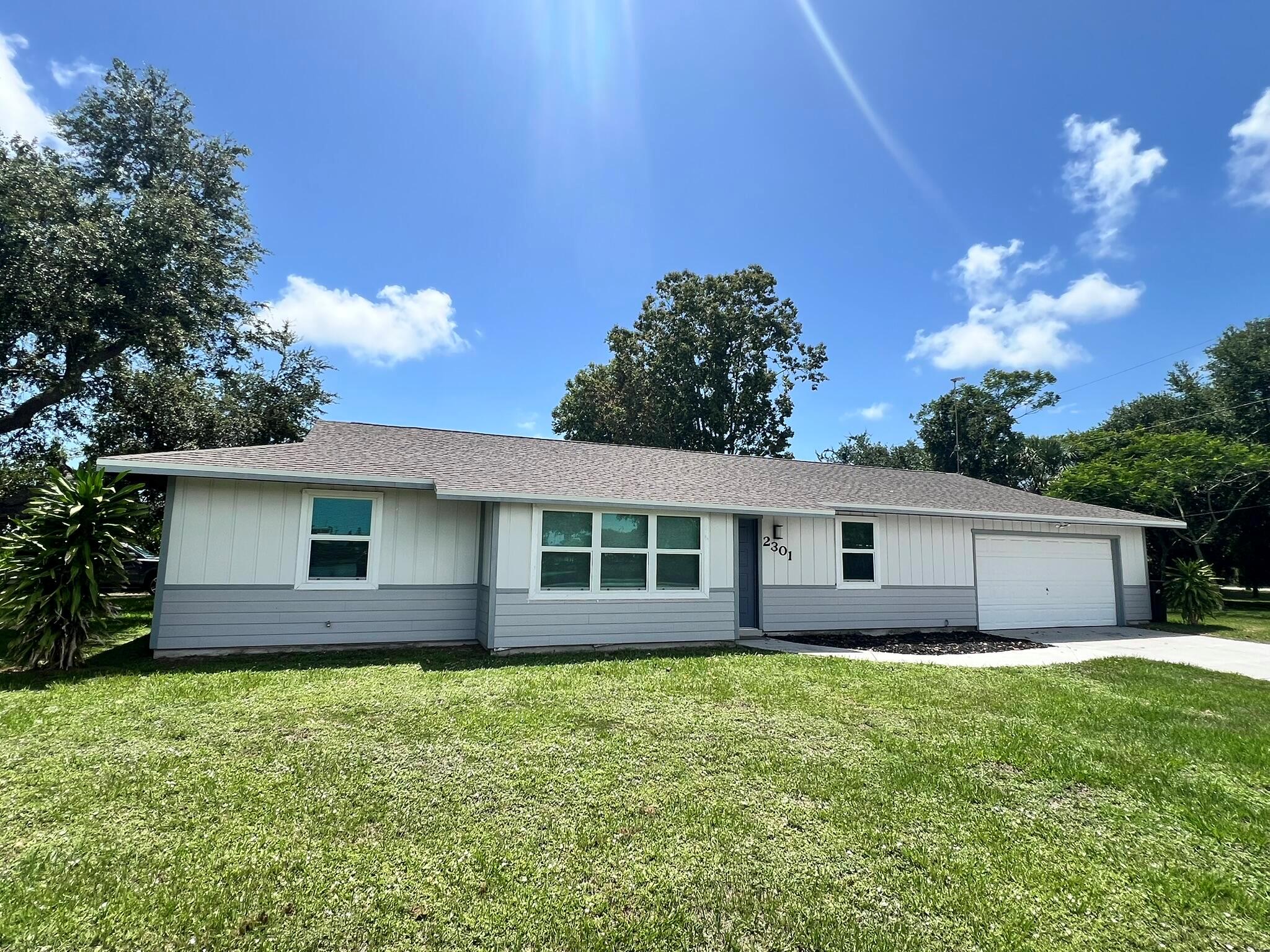 Totally upgraded 3 bedroom, 2 bath home on an over-sized lot has impact windows, stainless appliances, tile throughout, Samsung washer/dryer, screened patio, fenced yard, and 2 separate driveways. This home is also conveniently located east of US 1, close to shops, restaurants, etc. Lawn maintenance is included. Don't miss your opportunity to rent a little piece of Paradise!
