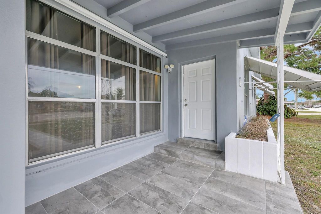 Photo of 225 NE Prima Vista Boulevard, Port Saint Lucie, FL 34983 (MLS # R10946723)