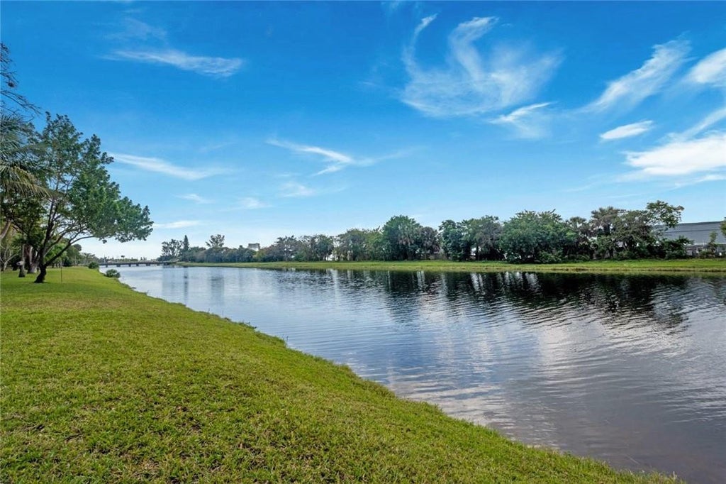 Photo of 2206 S CYPRESS BEND Drive #208, Pompano Beach, FL 33069 (MLS # B26090315)