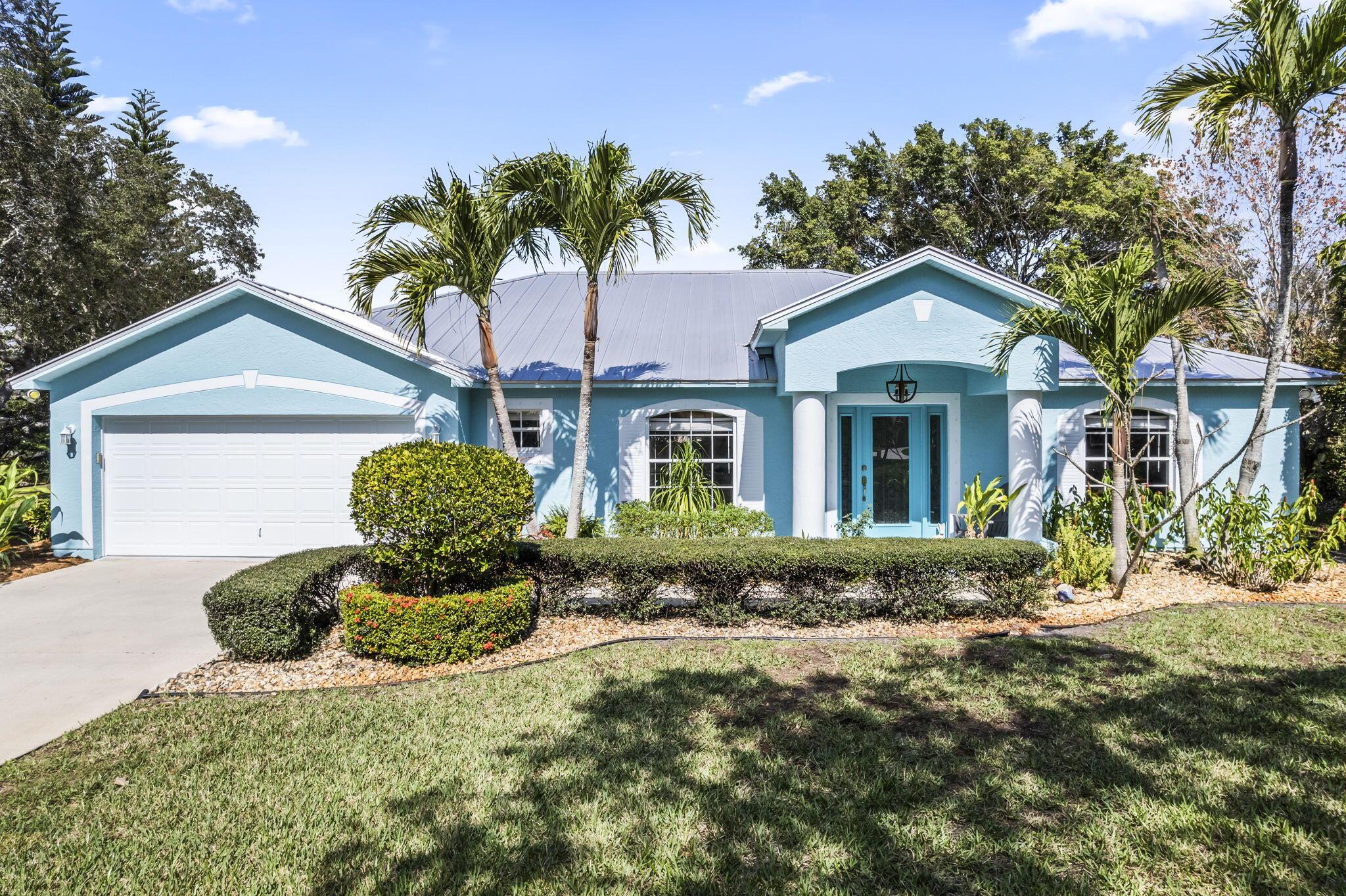 Discover the peaceful and small gated community of Vikings Landing! This beautifully landscaped and fully renovated home from floor to ceiling sits on a spacious 1/2-acre lot, offering exceptional privacy and room to grow. Additional improvements for the exterior include a newer premium metal roof and paint. The generous lot offers the flexibility to add a custom pool, guest house, workshop, or even an additional garage--giving you the freedom to truly make this property your own.The tropical backyard is ideal for entertaining, featuring a paved patio with a cozy fire pit surrounded by lush plants and mature trees. Vikings Landing also offers a private community boat and RV storage lot--perfect for all your toys. The low quarterly HOA fee keeps the community safe and well maintained.