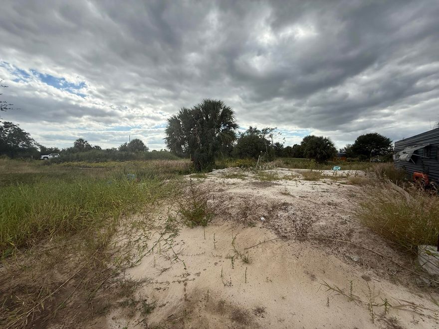 Beautiful 1.25-acre cleared lot featuring a peaceful pond, located in the desirable Prairie area of Okeechobee. This property is ready for your dream home, mobile home, or weekend getaway. Enjoy wide-open country views and plenty of room for animals, gardens, or recreational toys. The land offers easy access and a serene setting, ideal for those seeking privacy and space. No HOA and agricultural zoning allow flexibility for rural living. Whether you're looking to build, invest, or escape the city, this scenic property with its charming pond provides endless possibilities.