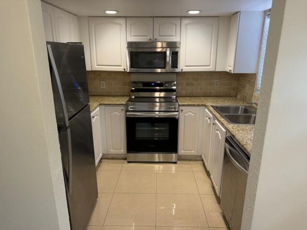 Photo of 10290 N Military 4a Trail #4a, Palm Beach Gardens, FL 33410 (MLS # R11098367)