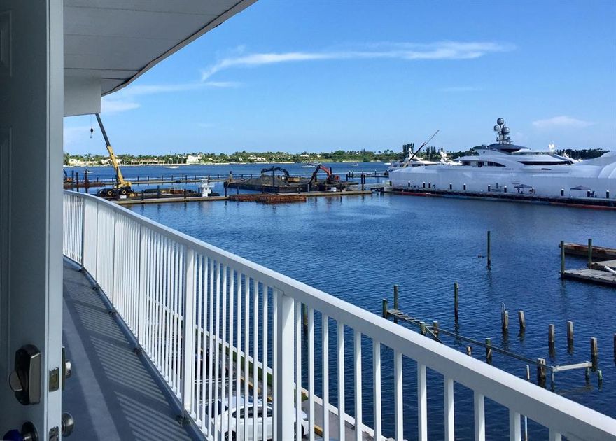 Watch the yachts go by from your balcony and enjoy the breezes and views of the pool from the screened porch in this fully renovated, newly decorated, and furnished 2 bedroom 1 and a half bath condo. This unit has just been re-modeled with a new kitchen and baths including new stainless steel appliances, and fine wood cabinetry with beautiful granite counters, and progressive new lighting. All ceramic tile flooring with no carpet. The community features a storage area, elevator next to this unit, 2 BBQ areas, a club house, and community pool overlooking the Intracoastal Waterway and basic cable is included. Assigned parking, plenty of guest parking. Convenient to downtown West Palm Beach, Shopping, Beaches, Air and Sea Ports, Hospitals, City Place, and Historical Northwood