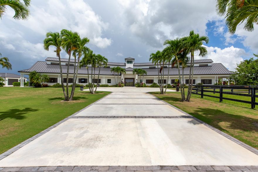 Exceptional opportunity to own a custom built, gated equestrian property on over 10 acres in the coveted Wellington Preserve! Featuring an extravagant main house with 4 beds, 4 full baths, an office, and an oversized 3-car garage. The stunning outdoor living space includes a resort-worthy pool, spacious covered lanai with a full outdoor kitchen and bar, and a one-bedroom pool house with kitchenette, full bathroom and two lanais. Built for the elite equestrian, the 14-stall barn includes interior and exterior wash stalls, vet/tack up area, feed and shavings rooms, air-conditioned lounge and tack room, and a full bath. This property is equipped with a 250'x140' all weather arena 150'x150' Grand Prix field, MK 6-horse walker, and a perimeter exercise track. The caretakers cottage ...