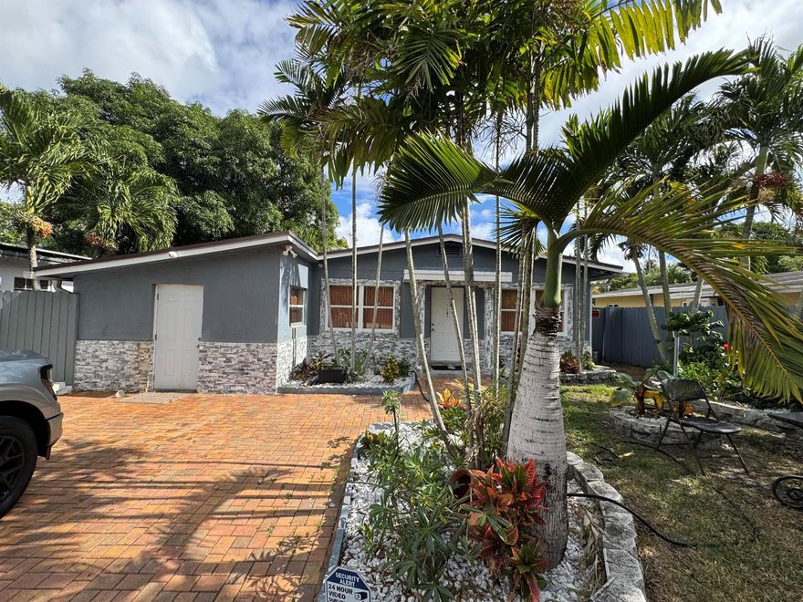 Charming 2-bedroom, 1-bath home with two kitchens located in the highly desirable Progresso neighborhood of East Fort Lauderdale. Just minutes from the beach and Las Olas Boulevard, this property offers the perfect blend of city convenience and tropical tranquility. Surrounded by lush vegetation, the home feels like a private oasis.Enjoy a large, fully fenced yard with beautiful landscaping, an ideal space for outdoor living and even room to add a pool. The home features a newer permitted roof and numerous interior upgrades.Inside, the main kitchen showcases white shaker cabinets, quartz countertops, and stainless steel appliances. Additional highlights include new ceramic flooring throughout, fresh interior paint, new recessed lighting, modern fixtures, and ceiling fans. The stylish