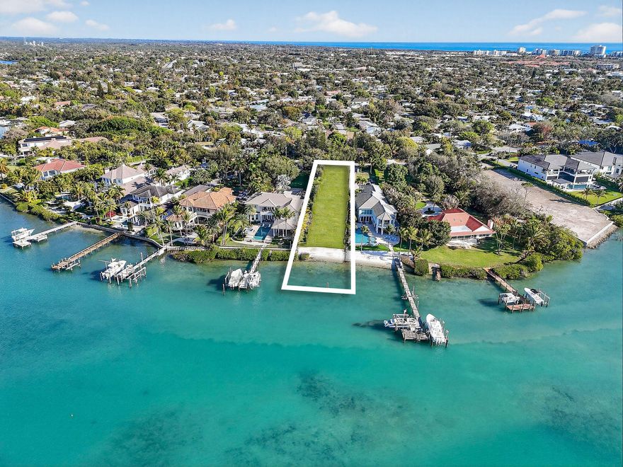 An unmatched opportunity awaits! This rare property is truly one-of-a-kind, offering a prime position at the mouth of the Loxahatchee River with 60 feet of pristine, private white sand beach. Stunning, sweeping views of the protected Loxahatchee River Preserve & the Jupiter Inlet, where natural beauty meets endless recreation. Launch a boat for a quick cruise down the Intracoastal, glide upriver on a paddleboard, or simply unwind as the sky transforms with vibrant sunsets over the water. Located on the widest part of the river and just minutes from fine dining, art galleries, boutique shopping, ocean beaches, and world-renowned golf courses, the lifestyle here is as convenient as it is exclusive. Set well back from the road and surrounded by lush, mature tropical fruit trees, the property offers exceptional privacy and the perfect canvas to create your dream estate. With the feel of a secluded nature sanctuary, this property is unlike anything else available. Opportunities like this are once in a lifetime. ** Some of the photos are digitally rendered.