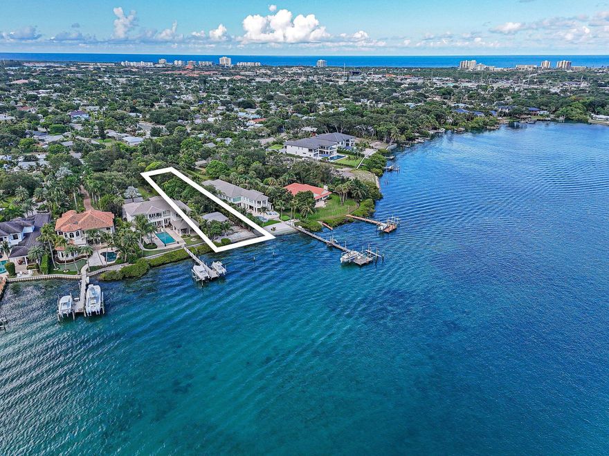 An unmatched opportunity awaits! This rare property is truly one-of-a-kind, offering a prime position at the mouth of the Loxahatchee River with 60 feet of pristine, private white sand beach. Stunning, sweeping views of the protected Loxahatchee River Preserve & the Jupiter Inlet, where natural beauty meets endless recreation. Launch a boat for a quick cruise down the Intracoastal, glide upriver on a paddleboard, or simply unwind as the sky transforms with vibrant sunsets over the water. Located on the widest part of the river and just minutes from fine dining, art galleries, boutique shopping, ocean beaches, and world-renowned golf courses, the lifestyle here is as convenient as it is exclusive. Set well back from the road and surrounded by lush , mature tropical fruit trees, the