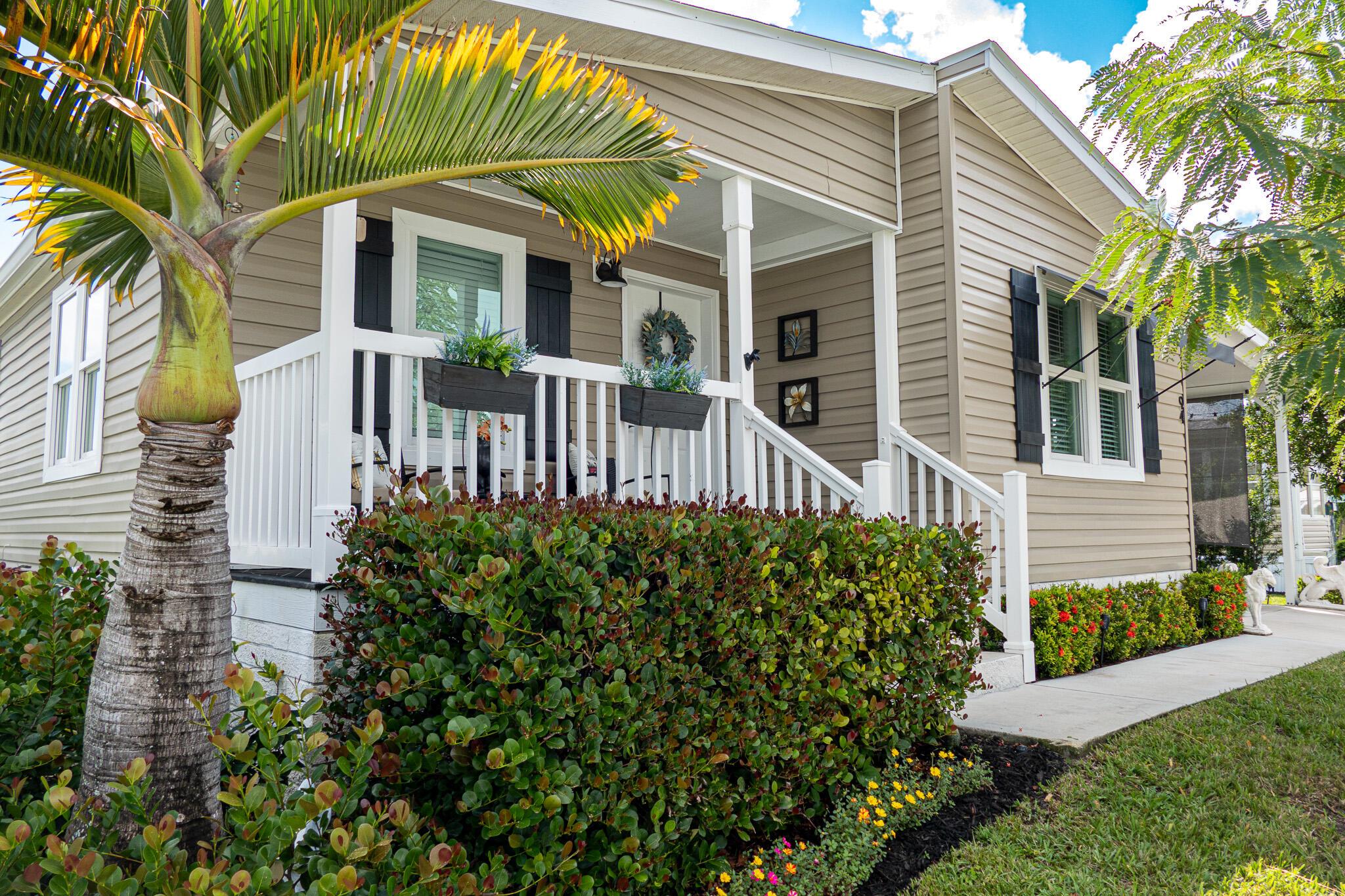 Updated 2-bedroom, 2 bath home with hurricane impact glass throughout.  Updated in 2021 with smart technology.  Kitchen features stunning granite countertops, tile backsplash, stainless steel smart appliances with refrigerator and access to your phone to look inside.  Kitchen flows into dining and living areas for relaxing or entertaining.  Primary suite offers large walk-in closet and remodeled bathroom with dual vessel sinks, granite counters, glass-enclosed shower and textured 3D tile for a spa-like feel.  Second bathroom with granite countertop and unique vessel sink.  Lovely yard with colorful flowers and interesting trees, roomy 9.5' x 12' shed for extra storage.  Excellent location, minutes from downtown Jensen and the beaches.