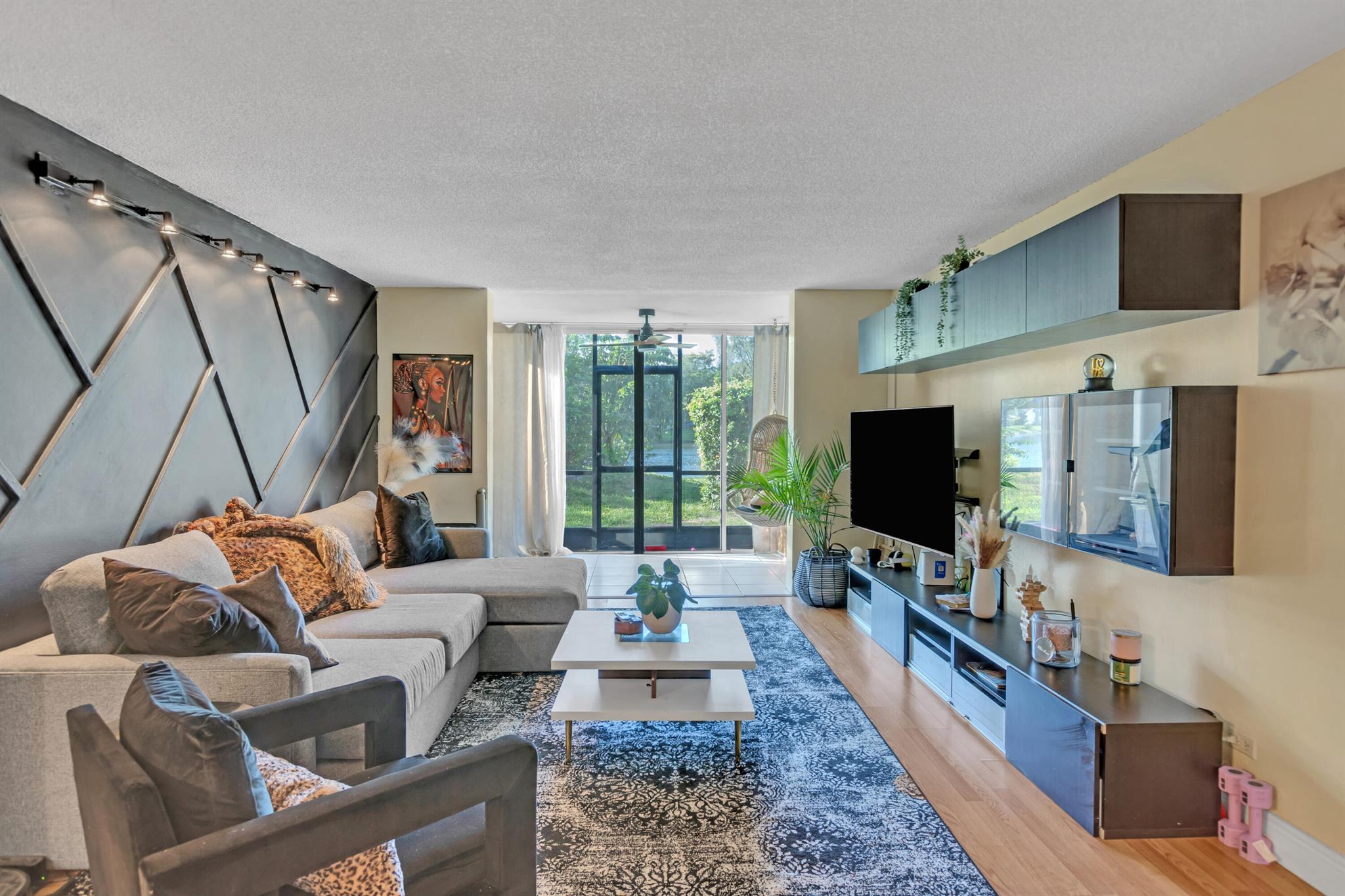 Motivated!! Step inside this cozy condo on the water in the quiet community of International Village. As you enter you'll first notice the beautiful accent wall in the spacious living room in the middle of the split floor plan. The primary suite is offering a spacious bedroom and updated bathroom and shower. As you continue you'll see the recently updated guest bathroom, new vinyl flooring in the second bedroom and updated kitchen with all newer stainless-steel appliances. This unit also boast a dinning room with plenty of clearance to host dinner parties with family and friends, a glassed patio with plenty of natural light that can be used as a workspace overlooking the water right outside your back sliding glass door. Seller will give credit towards closing cost w/full price offer.