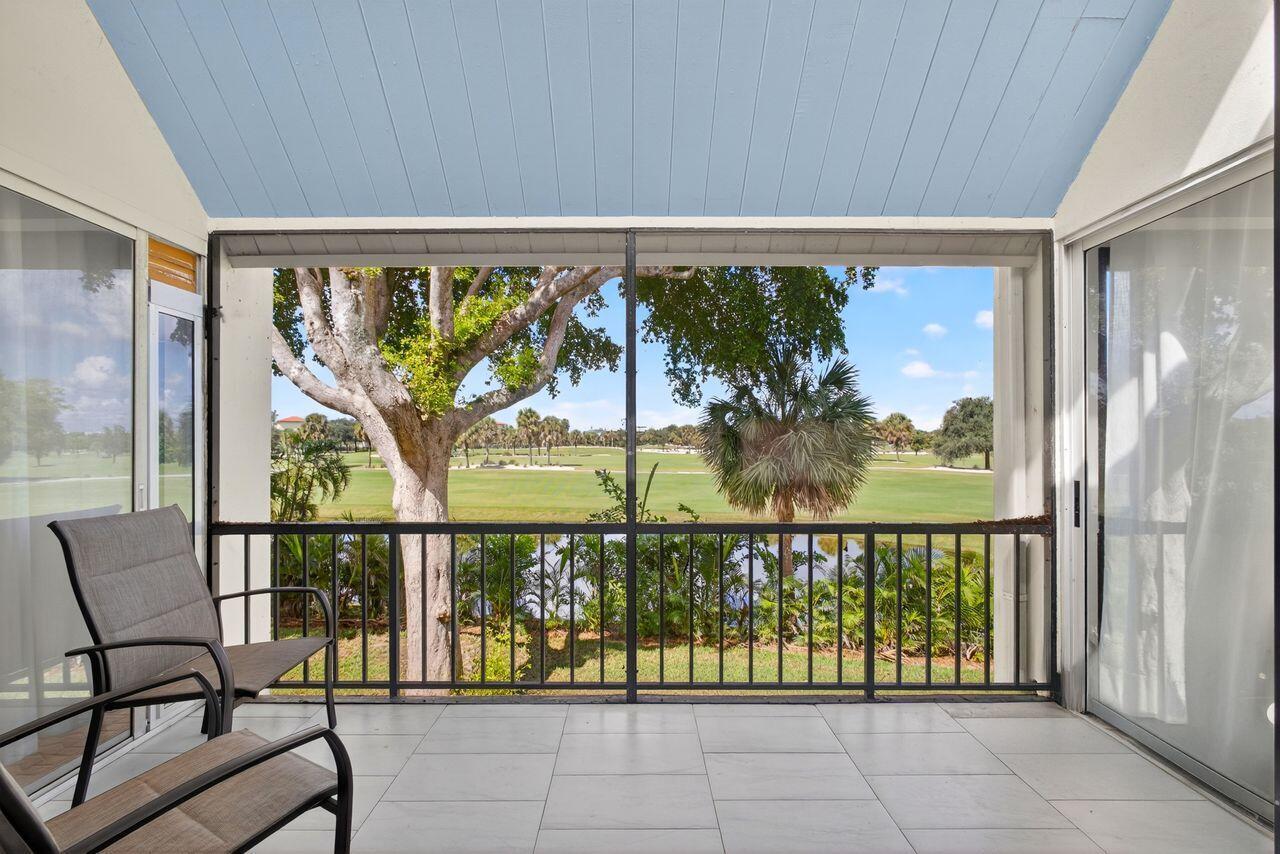 Step into this stunning two bedroom, two bath condo in a gated community just 5 minutes from downtown and 10 minutes from the beach. Enjoy breathtaking golf course views through floor-to-ceiling impact glass windows and relax on two covered patios which are perfect as sunrooms or office dens. Every inch of this home was upgraded with high-end tile flooring throughout, format accent wall tiles, wooden slat detailing and satin-finish Behr Marquee paint. The kitchen is a chef's dream with stone countertops, granite sink, full backsplash, soft-close cabinetry and smart LG appliances including a steam dishwasher and oven/air fryer combo. Smart home features include recessed LED lighting and Alexa/Google-compatible switches. See More