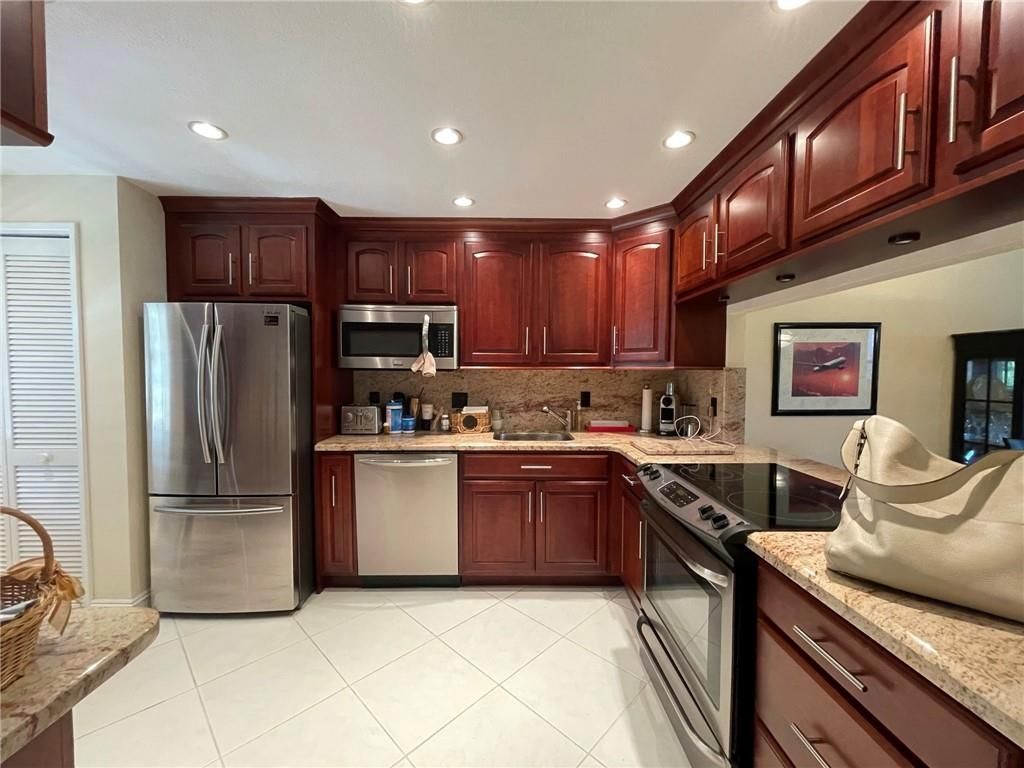Photo of 545 Oaks Ln #207, Pompano Beach, FL 33069 (MLS # F10269699)