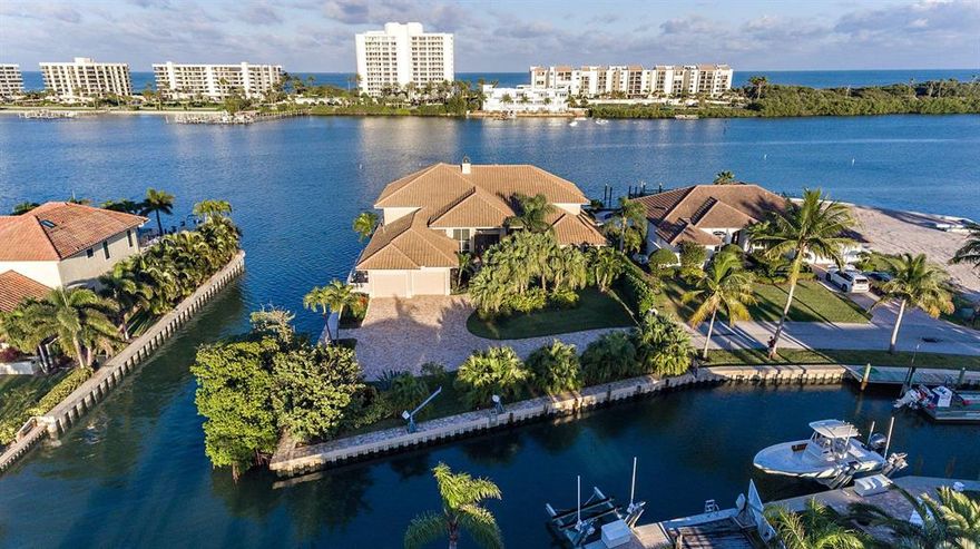 Unbelievable opportunity to be on the wide ''blue water'' Intracoastal and have deep water canals wrap around your home! Fully fenced and gated property located on its own peninsula gives you total privacy. Panoramic due east views of the Intracoastal. This custom home has been completely renovated with the best of everything including impact windows, roof, custom cabinetry, kitchen, top-of-the-line appliances, baths, chiseled travertine and wood floors, sofisticated electronics, pool/jacuzzi, 36 kw whole house generator, 16,000 pound boat lift, fireplace, central vac, custom built ins and moldings, and more! Master suite & 2 bedrooms are downstairs. 2 complete guest suites with private balconies are upstairs.  Close to restaurants, shopping & everything else Jupiter/Tequesta has to offer.