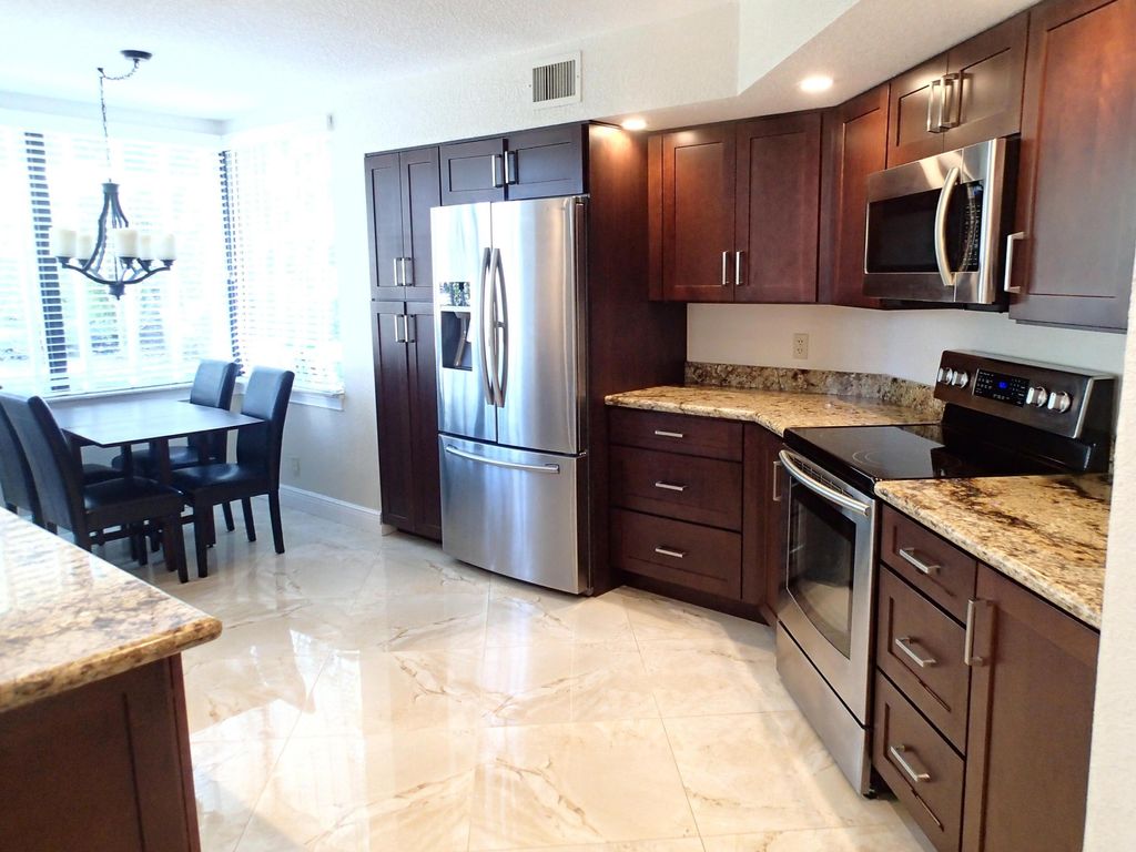 Photo of 115 Bay Colony Drive N, Juno Beach, FL 33408 (MLS # R11009593)