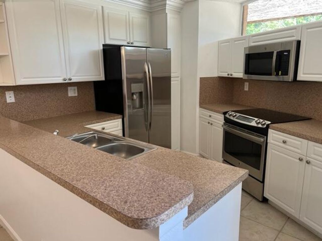 Photo of 8285 Severn Drive #B, Boca Raton, FL 33433 (MLS # B26007917)