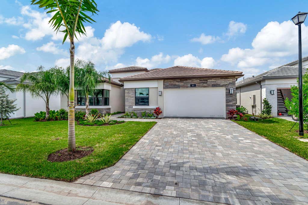 Photo of 9814 Evergreen Woods Lane, Boynton Beach, FL 33473 (MLS # R11005839)