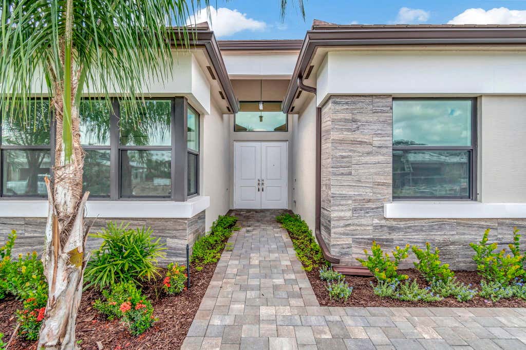 Photo of 9814 Evergreen Woods Lane, Boynton Beach, FL 33473 (MLS # R11005839)