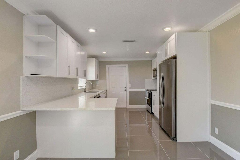 Photo of 3020 Tropical Trail, Lake Worth, FL 33462 (MLS # R11110638)