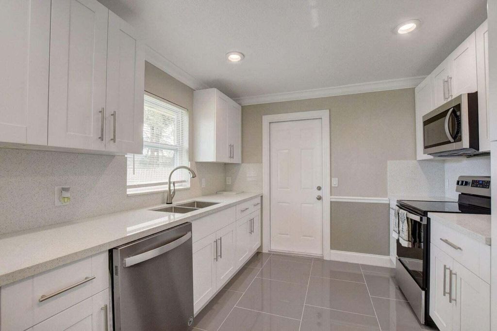 Photo of 3020 Tropical Trail, Lake Worth, FL 33462 (MLS # R11110638)