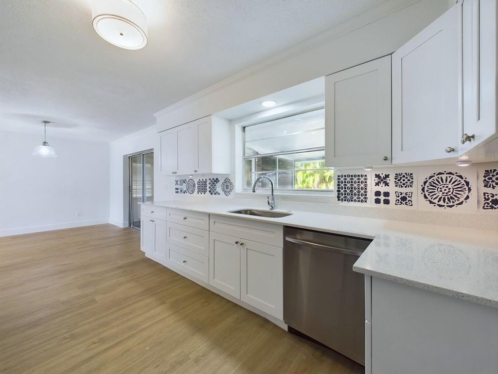 Photo of 711 SE Voltair Terrace, Port Saint Lucie, FL 34983 (MLS # F10415083)