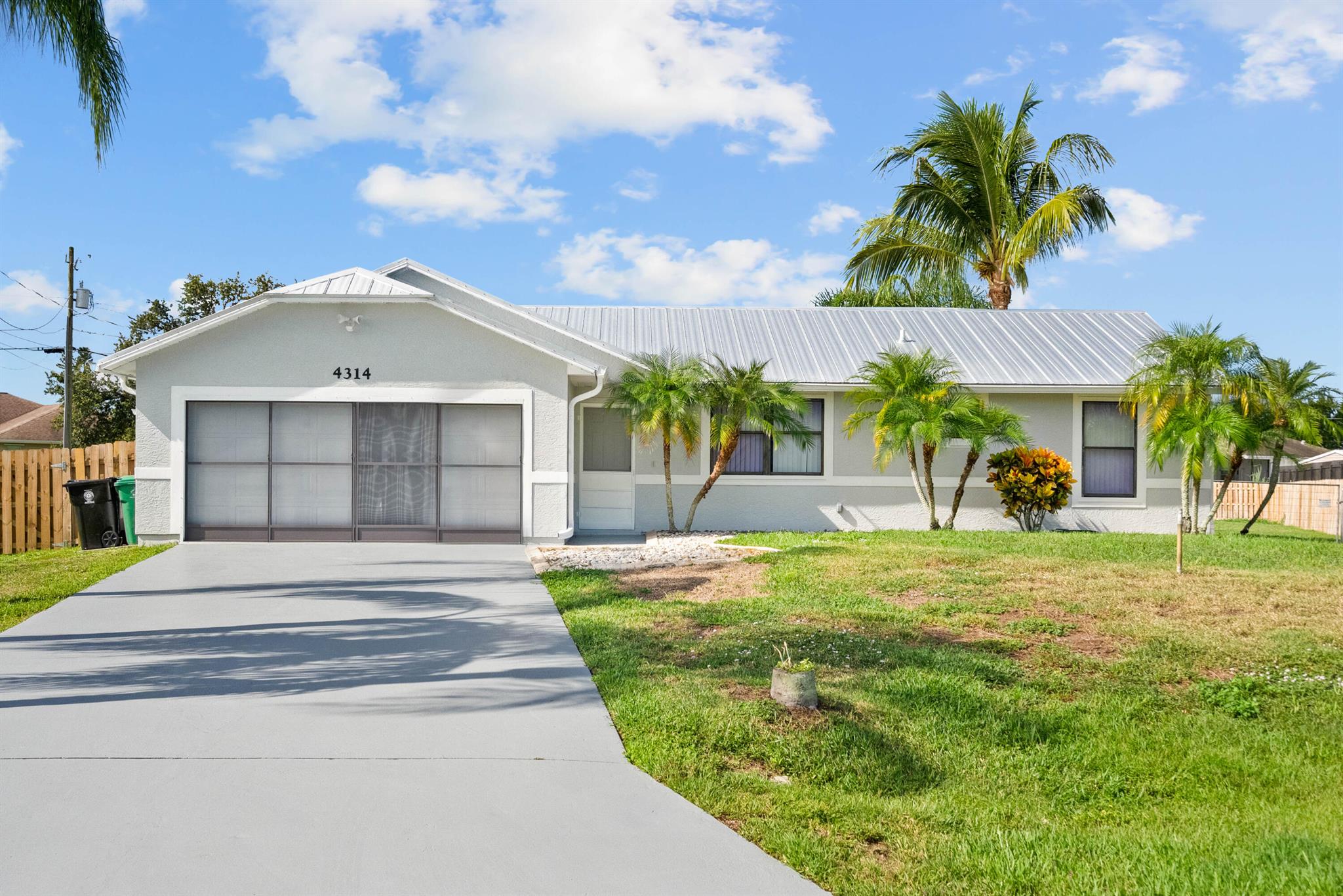 Discover this beautifully updated 3 bed, 3 bath split-plan home featuring a massive CBS master suite with a walk-in closet that doubles as a safe room. Enjoy peace of mind with a NEW 5V metal roof and fresh interior/exterior paint. The updated kitchen boasts granite countertops and plenty of space for cooking and entertaining. Relax in the screened-in pool or enjoy the oversized, fully fenced backyard, perfect for gatherings or gardening. The property also includes a large shed and two roofed parking areas ideal for a boat, RV, or extra vehicles. Don't miss this move-in ready gem with space, style, and security!