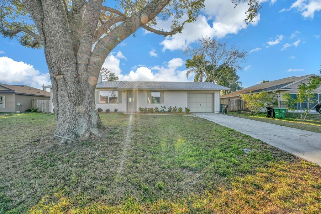 Photo of 1722 SE Biddle Lane, Port Saint Lucie, FL 34983 (MLS # R11159866)