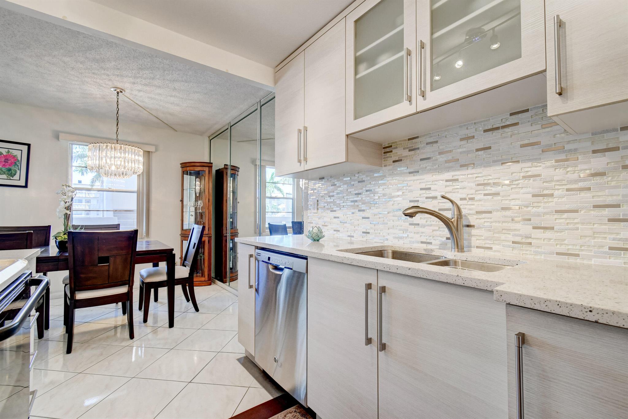 CENTURY VILLAGE--SUPER ACTIVE ADULT COMMUNITY!The heart of Boca Raton, FL, is a captivating second-floor condominium situated in the vibrant Century Village community. Exuding elegance and filled with natural light, this property presents a stunning canvas awaiting personal touches.The Chef's dream of this condo is in the kitchen. Recently enhanced with polished quartz countertops and a stylish backsplash, this culinary paradise also boasts new wooden cabinets that offer ample storage for all your kitchen needs. It recreates the ambiance of a professional cooking space, attracting those who harbor a passion for gourmet cuisine.