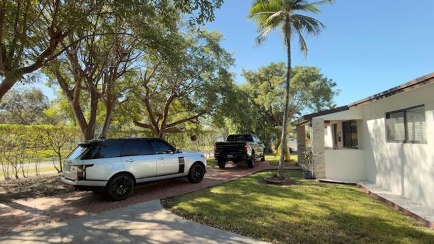 Significantly recently remodeled corner with circular driveway home conveniently located in Cutler Bay close to a Turnpike exit! Cutler Bay Park is a stroll away! Bright and open floor plan suitable for modern living. The house features impact doors and windows.Air conditioning system replaced in 2025.ankless water heater. LED lighting. Gas and electric kitchen. Enclosed terrace with air conditioning. Aluminum fencing around the entire property with a side entrance for boat. Granite countertops. Easily parking for up to 10 cars. Shed in the patio. Hurry up , it won't last long.