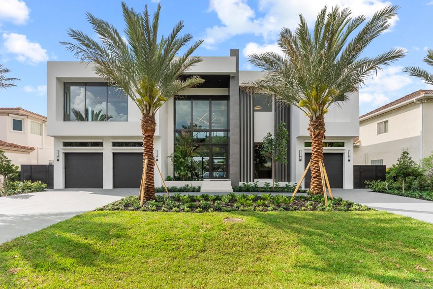 A must-see new construction waterfront estate, scheduled for completion February 2026, located in the highly desirable Tropic Isle neighborhood. This residence offers approximately 5,705 SF of living space. Featuring wide canal frontage with southern exposure, the property includes approx. 90 feet of waterfront, a new seawall, 70' concrete dock, and 24,000lb boat lift with quick Intracoastal and ocean access. Outdoor living includes a saltwater pool, oversized spa, and summer kitchen. Interior highlights include soaring ceilings, glass entry,  impact windows and doors, open-concept living, chef's kitchen with Sub-Zero and Wolf appliances, quartz countertops, wine feature wall, clubroom with bar, elevator, and second-floor lounge. Additional 48kW generator, home office, and ample storage