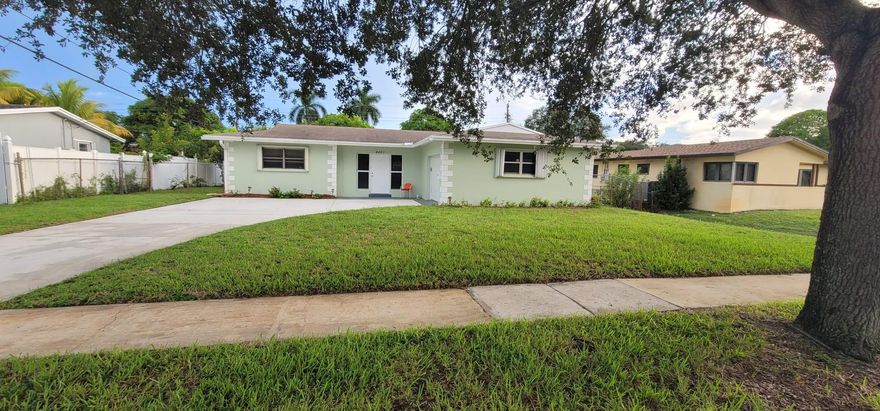 Tucked away in a peaceful neighborhood, this beautifully maintained 3 bed / 2 bath home offers comfort and style with a fully remodeled second bathroom, stainless steel appliances, and spacious living & dining areas perfect for entertaining. Enjoy the convenience of a 1-car garage, washer/dryer, and ample driveway space. Relax year-round in the huge enclosed Florida room, or pick fresh fruit in your private backyard oasis. Accordion shutters provide added peace of mind. It is 15 minutes from the airport and all major universities: Nova, FAU, & Broward College. Nine minutes from Westside Regional Hospital, nine minutes from Broward Mall, and 20 minutes from the Fort Lauderdale beach. Close and easy access to Florida's turnpike, I-95, and I-595.