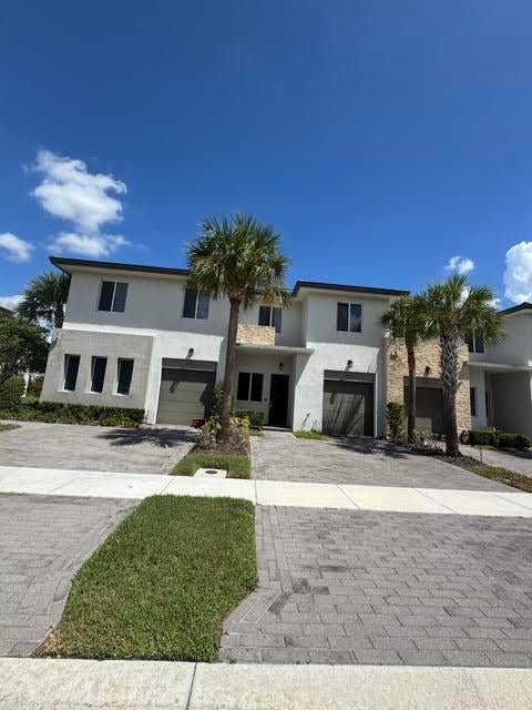 Photo of 551 PIONEER Way, Royal Palm Beach, FL 33411 (MLS # B26069865)