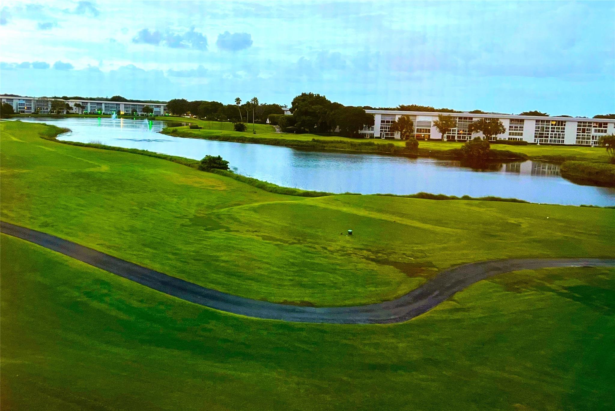TURN-KEY FURNISHED PENTHOUSE with SPECTACULAR GOLF/WATER/FOUNTAIN VIEW from the HURRICANE GLASS ENCLOSED PATIO Plus TOTAL REMODEL Including SLATE STYLE TILE FLOORS and SMOOTH CEILINGS THRU-OUT and an OPEN DESIGN KITCHEN with STAINLESS STEEL APPLIANCES, Wood Cabinetry and GRANITE Counter/Backsplash Plus a SHOWER IN BOTH BATHROOMS and BUILT-IN CLOSETS. Conveniently Located NEXT TO CLUBHOUSE. ASSOCIATION REQUIRES ONE OCCUPANT 55+ PLUS $250 REFUNDABLE MOVE-IN FEE. ONE VEHICLE ONLY. Information Deemed Reliable but, Not Guaranteed. PARKING SPACE 126