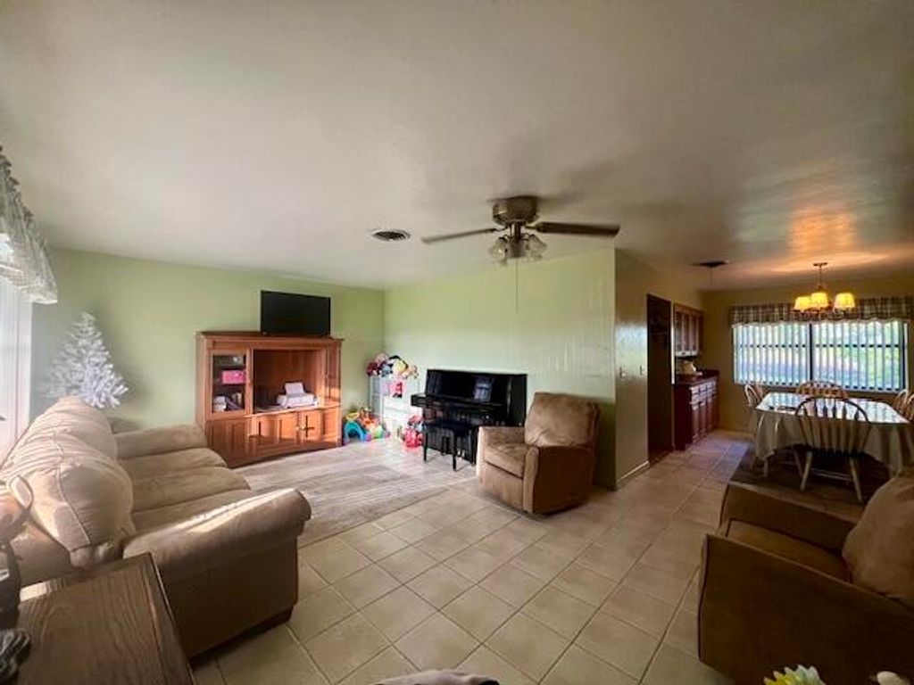 Photo of 1309 Wedgworth Road, Belle Glade, FL 33430 (MLS # R11025914)