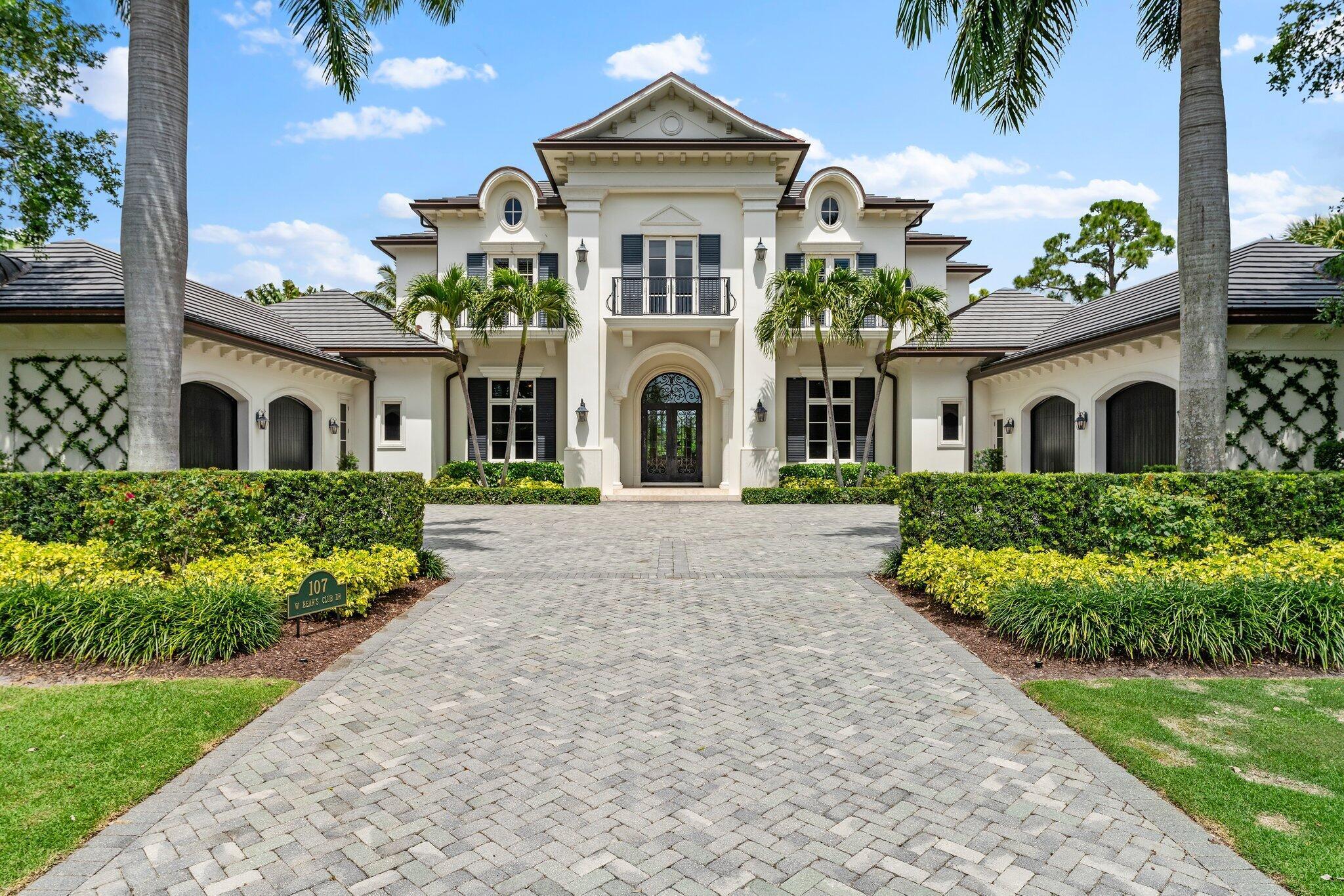 Stunning custom built estate in one of the most exclusive private communities in Palm Beach County, The Bears Club. This sprawling transitional estate offers 5 bedrooms in the main house with an additional bonus guest house suite attached to the main house with a lovely covered arched breezeway. With 5 Bedrooms, 8 full baths , and 2 half baths , this sprawling estate is nestled on nearly an acre of pristine manicured land offering some of the longest golf and lake views in The Bears Club. With extraordinary property features throughout, top tier finishes, and an upstanding transitional interior aesthetic, Additional amenities include dual offices, home theater, full gym, wine room. New Roof in 2022. AC square footage does not include newly enclosed loggia/summer kitchen.