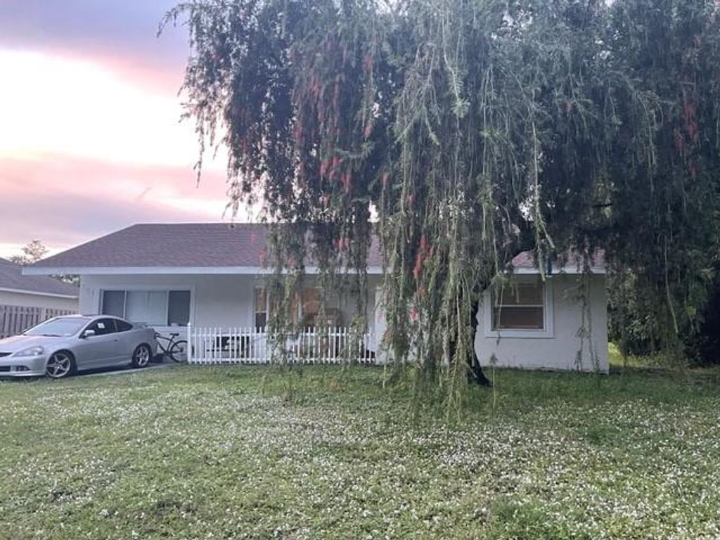 Photo of 261 SW Pisces Ter, Port Saint Lucie, FL 34984 (MLS # F10308188)