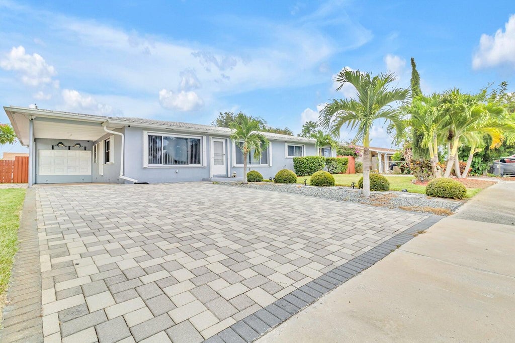 Photo of 4171 WATERWAY Drive, Lake Worth, FL 33461 (MLS # B26072055)
