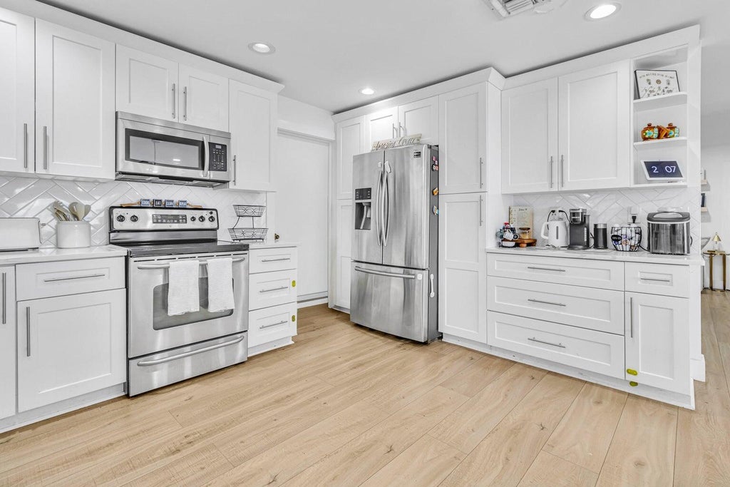 Photo of 4171 WATERWAY Drive, Lake Worth, FL 33461 (MLS # B26072055)