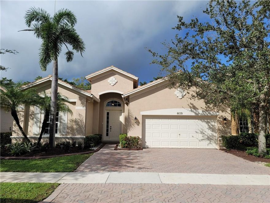 GREAT ONE STORY 4 BEDROOMS 3 BATHROOMS TRIPLE SPLIT HOME IN THE EXCLUSIVE GUARD GATED COMMUNITY OF ISLES OF WESTON. TILE FLOORING ,  IMPACT WINDOWS AND DOORS, NEWER HIGH EFFICIENCY A/C UNIT, (LOW ELECTRIC BILL)BEAUTIFUL GOURMET KITCHEN WITH STAINLESS STEEL APPLIANCES AND GRANITE COUNTER TOPS WOODCABINETS, ENTIRE HOUSE FILTERING WATER SYSTEM, FENCE IN YARD. DON'T MISS THIS OPPORTUNITY TO OWN THIS EXCLUSIVE HOME IN THE SOUGHTAFTER ISLES AT WESTON WITH RESORT STYLE AMENITIES TO INCLUDE GYM, POOL, CLUBHOUSE, TENNIS ANDMORE. WALK TO BEST RATED A+ SCHOOLS IN WESTON. CLOSE TO RESTAURANTS SHOPPING AND HIGHWAYS,JUST ABOUT 20 MINUTES AWAY FROM BEACH.