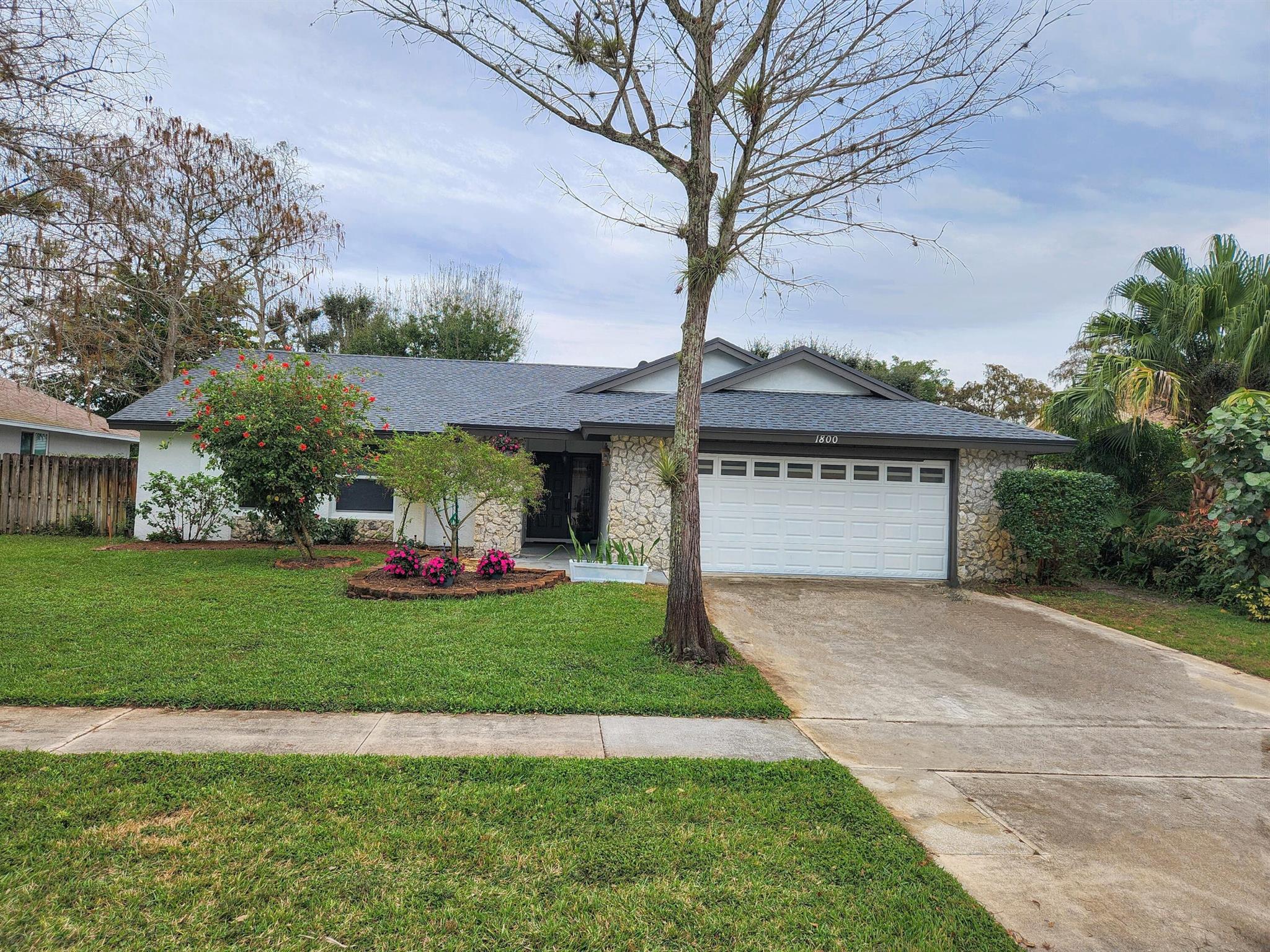 Awesome SF home in Wellington with practically EVERYTHING New - incl Roof, impact windows, range, refrigerator, dishwasher, washer, dryer, microwave, AND freshly painted.Wide open floor plan with large kitchen a snack bar and dining area. The Fam Room has a beautiful fireplace. Enjoy the evenings on your large screened patio. The yard is fenced, and pets will be considered on a case by case basis.