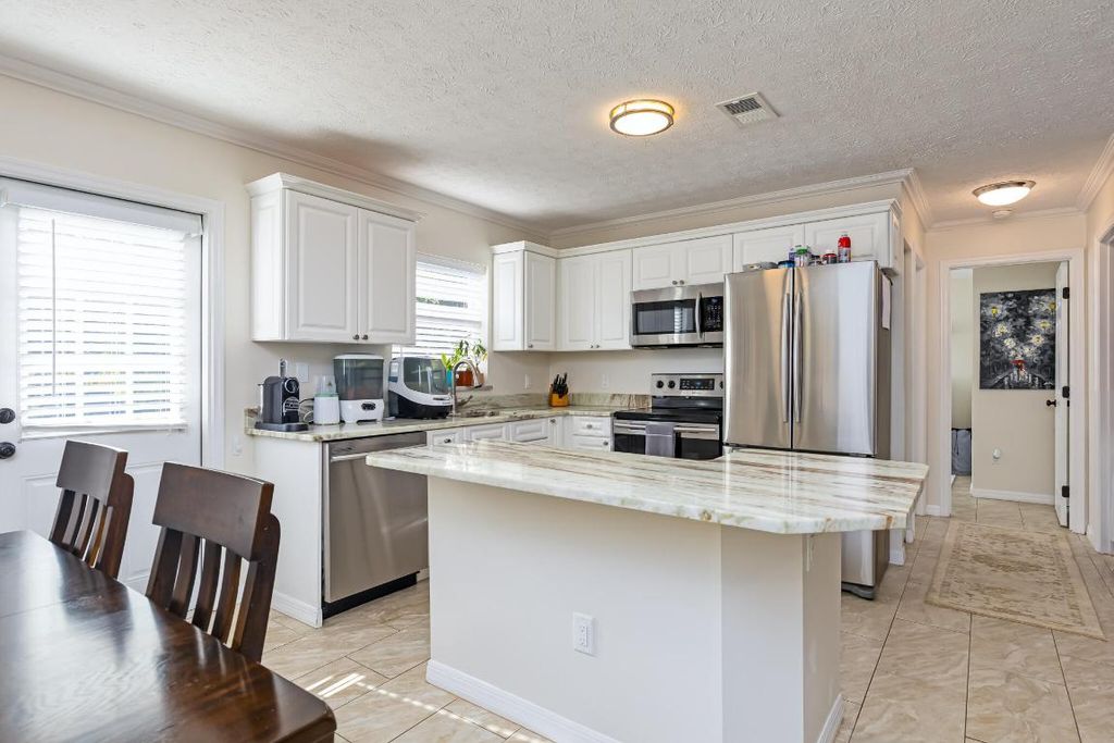 Photo of 1292 SW Bellevue Avenue, Port Saint Lucie, FL 34953 (MLS # R11153310)