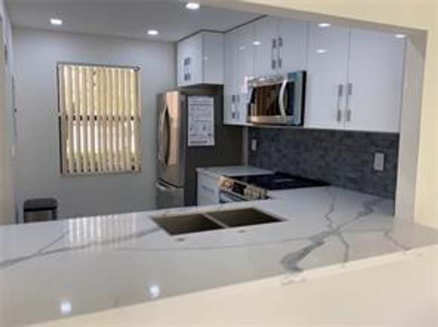 Nice first floor apartment,corner unit 2 bed 2 bath Plus a den in sunrise lakes Subdivision phase 4 Building 173.    Over 55 community. Brand new ss Appliances washer and dryer inside the apt brand new a/c unit ,water sewer trash cable internet is included in you maintenance fee. Nice Tile flooring, golf view. Brand new roof, new elevators.
Seller will pay assessments at closing.  40-year certification completed. The community offers several amenities. The gym and clubhouse have been completely remodeled and offer shows, movies, bingo, shuffleboard, and an Olympic-sized pool. Don't miss this opportunity.!!!