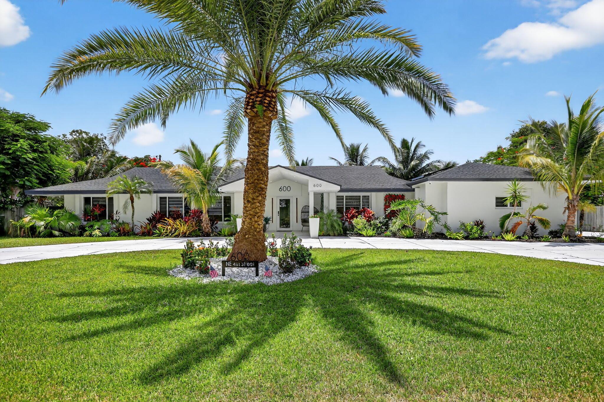 Welcome to your dream oasis in highly sought-after Pompano Beach! No expense spared in this fully updated 5-bedroom, 3-bath gem sits on a lush 1/2-acre lot just minutes from the ocean. Impact windows and doors, solar panels, and a sprinkler system fed by a private well. With over 100,000 invested in Solar Panels, just think of all the money you will save! Step inside to a bright, open floor plan. Cabana bath and outdoor shower--perfect for indoor-outdoor living. Relax in the heated pool, cook in the outdoor kitchen with granite counters, or enjoy the tranquility of a Koi Pond, moat and waterfall. A commercial-grade playground adds fun for all ages. This home blends luxury, comfort, and modern flair-your perfect Florida lifestyle awaits. Security system and cameras in place.