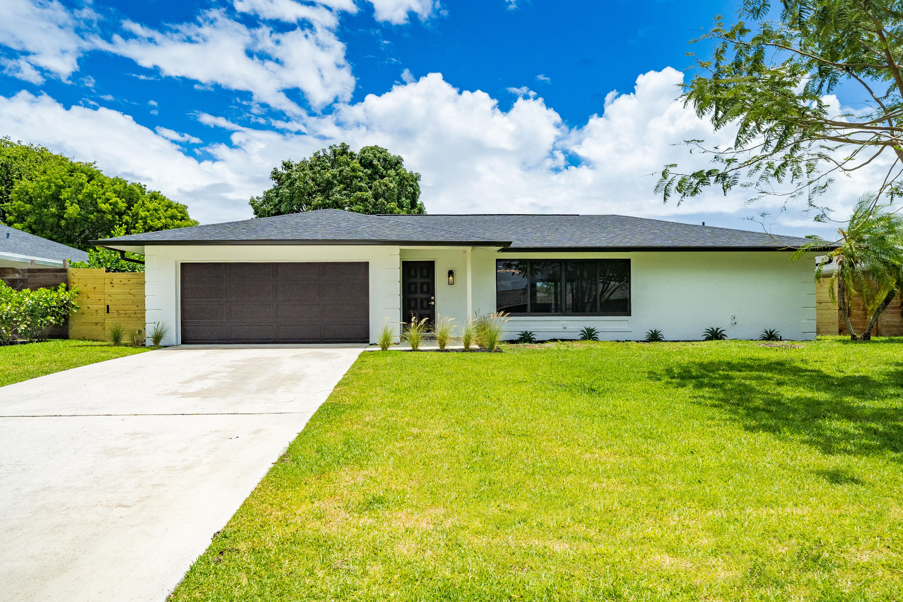 Gorgeous fully renovated, unfurnished, 4 Bedroom, 2 Bath, Pool Home w/ 2 Car Garage. Dec 1 move In. Located Garden Woods with no HOA. The renovated kitchen has a huge island that seats up to 7 and opens to the living room & dining room. The kitchen is complete w/soft close wood cabinets, stainless steel appliances & quartz countertops. The whole house has complete impact windows & sliders, 24'' x 48'' large format porcelain tile and recessed lighting. Both bathrooms have been fully renovated and the 2nd bath is also a cabana bath. The screened, covered patio opens to the pool deck and spacious fully fenced back yard. Large pets welcome. Lawn and pool maintenance included in rent.
