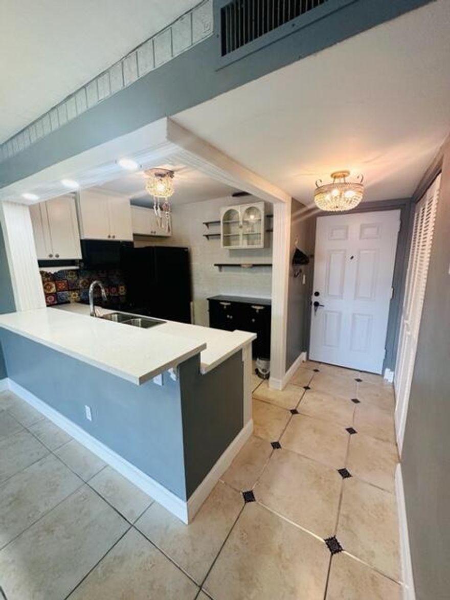 Stunning and completely updated 2-bedroom, 1-bathroom condo in the heart of Coral Springs! This bright and modern unit features a spacious open layout, fresh paint, new flooring, and a beautifully renovated kitchen with quartz countertops. The bathroom has been tastefully upgraded, and both bedrooms offer ample closet space. Enjoy a private balcony with peaceful views in a well-maintained community with a pool, tennis courts, and laundry facilities. Conveniently located near shops, parks, top-rated schools, and a wide variety of restaurants and cozy coffee shops--plenty to choose from just minutes away! Ready to move in