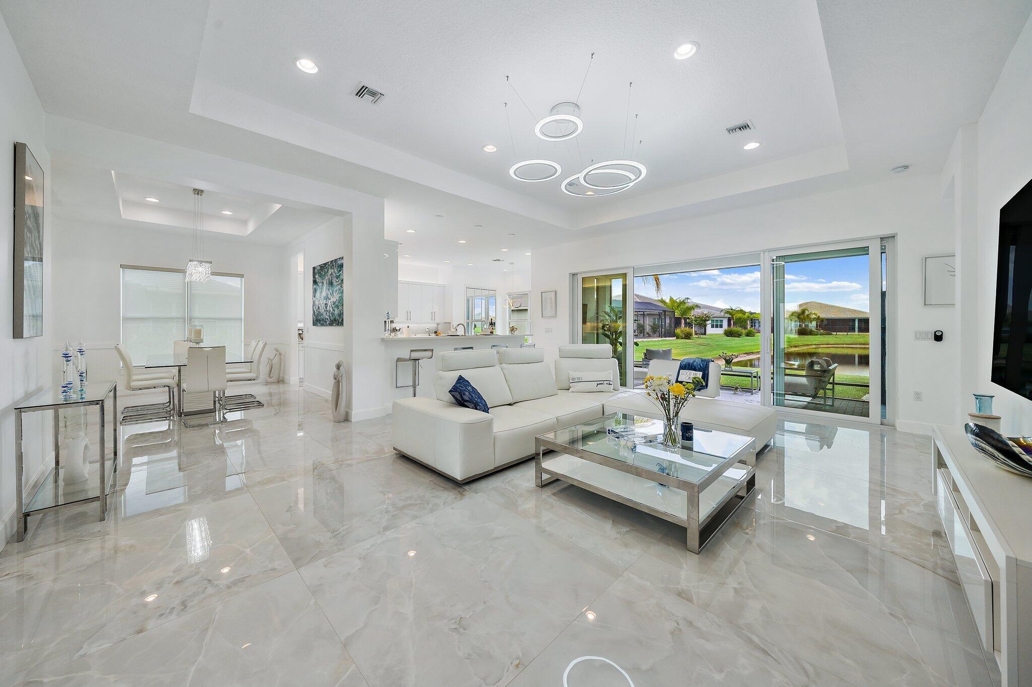 Come Experience this Modern Interior that exudes an Upscale Ambience. Over $100k+ of Upgrades throughout! Fabulous After Market 48' Polished Porcelain Floors, Modern Lighting Statement Pieces, Woodworking Finishes, and King & Queen California Master Bedroom Closets. Tankless Gas Water Heater, Electric Vehicle Hookup. Valencia Cay offers its own Spacious Clubhouse and Onsite Restaurant. At Riverland - State of the Art Professional Culinary Space, Arts and Culture Center, Resort Style Sports and Racquet Club-37 Pickleball Courts, 8 Hard Tru Tennis Courts, 3 Outdoor Pools & Fitness Center. Soon to complete -Indoor Sports Court & Pool. Furniture Package Available. All Information Deemed Reliable & Subject to errors & commissions. All Measurements are Approximate.
