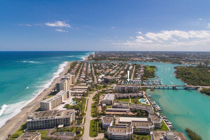 Incredible blue intracoastal, marina & lighthouse views surround this beautifully updated 2BR/2BA split-plan condo located in the waterfront community of Ocean Villas on Jupiter Island. Just a short walk to the private gated beach access. Desirable features include porcelain wood look tile flooring, wall-to-wall & floor-to-ceiling sliding glass doors, newly renovated kitchen with white shaker cabinets, quartz countertops & stainless steel appliances, & updated baths. Both bedrooms offer en-suite baths and walk-in closets. The expansive balcony is the perfect spot to sip morning coffee or relish glorious sunsets. Inside washer/dryer. Amenities include a common dock, community pool, paddleboard/kayak storage & BBQ area. Amazing restaurants & shops in nearby Tequesta. No pets.