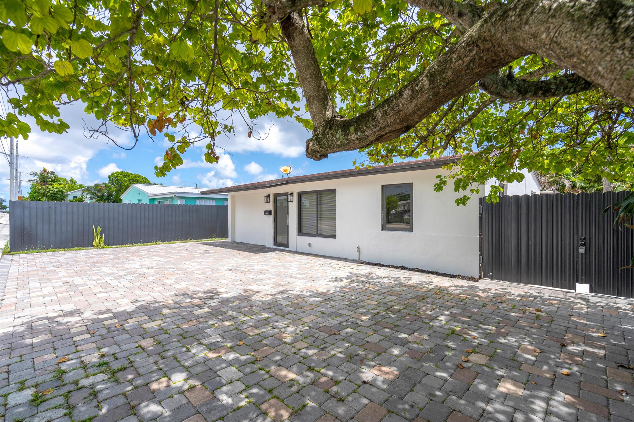 Just Listed in West Palm Beach!Welcome to this beautifully updated home on Parker Avenue, offering modern upgrades and an unbeatable location. Featuring a 2015 roof, impact windows and doors, a tankless water heater, and a sleek metal fence, this property blends style and functionality. The paved driveway adds great curb appeal, while inside you'll find stunningly renovated bathrooms with gorgeous finishes, a brand-new kitchen with modern appliances, and a stylish washer and dryer. Freshly painted inside and out, the home also boasts new lighting and contemporary touches throughout -- and so much more!Ideally situated just minutes from the beach, the Palm Beach Zoo, and all the attractions West Palm Beach has to offer, this home is move-in ready and waiting for you.